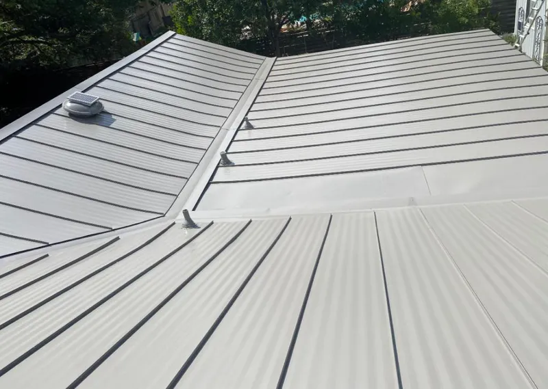 Solar attic fan installed on a metal roof for Roof Ventilation in Alondra Park